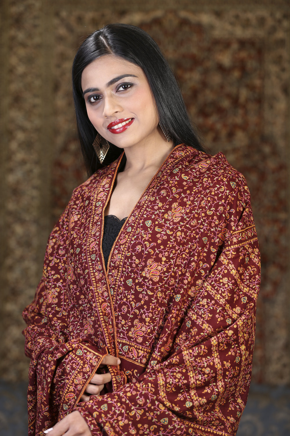 Burgundy embroidered pashmina evening wrap styled over the shoulders